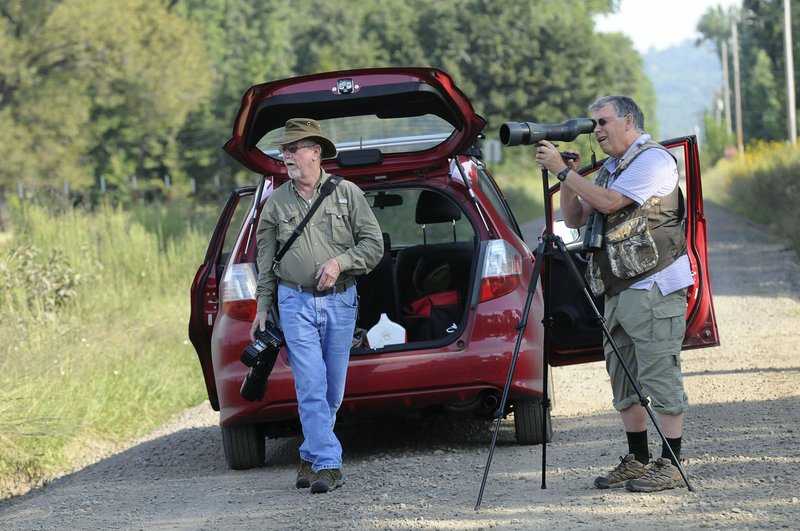  David Oakley of Springdale (left) and Joe Neal of Fayetteville stop Sept. 16 2016 at Frog Bayou Wildlife Management Area near Alma to look for birds. Neal has a birding route in the Arkansas River Valley that includes several stops to see birds on land and water. Oakley is an expert on dragonflies and enjoys photographing them, as well as birds.