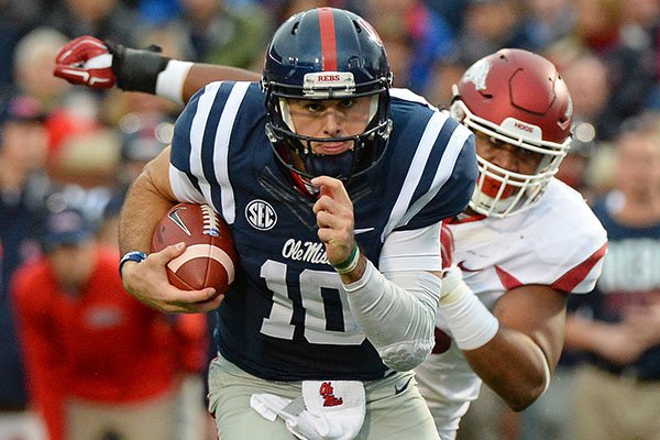 Mississippi quarterback Chad Kelly (10) runs the ball during the second quarter of an NCAA college football game against Arkansas in Oxford, Miss., Saturday, Nov. 7, 2015. (AP Photo/Thomas Graning)
