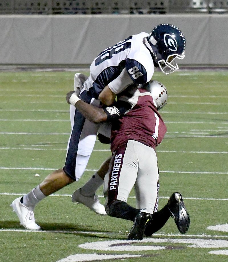 Bud Sullins/Special to the Herald-Leader Siloam Springs senior Kormah Dorko, right, makes a tackle on Greenwood&#8217;s Josh Barlow during last week&#8217;s game at Panther Stadium. Siloam Springs plays at Lake Hamilton on Friday.