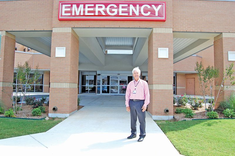 Gary Bebow, CEO of White River Medical Center, stands in front of the center’s renovated emergency department, which is expected to open this month. The department now includes a covered driveway, two trauma rooms, a family consultation room and more.