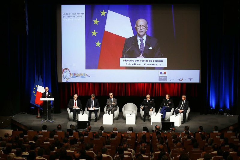 France’s interior minister, Bernard Cazeneuve, delivers his speech to security forces Wednesday in Paris, the same day a government decree reshaped reserve forces for added security. 
