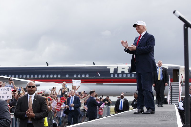 Republican presidential candidate Donald Trump arrives to speak at a campaign rally, Wednesday, Oct. 12, 2016, in Lakeland, Fla. (AP Photo/ Evan Vucci)