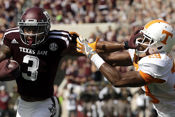 Texas A&M wide receiver Christian Kirk (3) breaks away from Tennessee defensive back Evan Berry (29) to score a touchdown after catching a pass during the first half of an NCAA college football game Saturday, Oct. 8, 2016, in College Station, Texas. (AP Photo/David J. Phillip)

