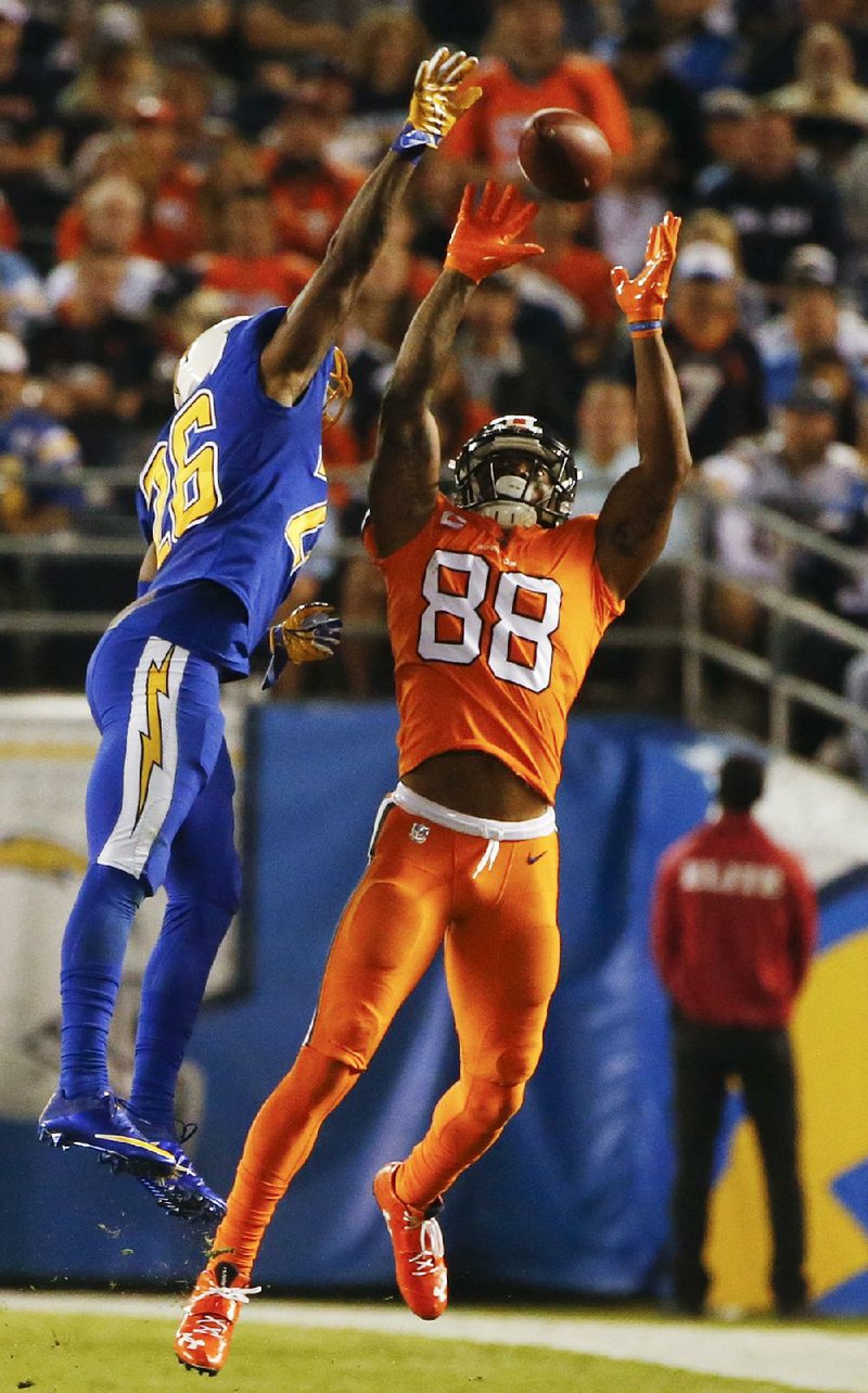 San Diego cornerback Casey Hayward (left) defends a pass intended for Denver’s Demaryius Thomas (88) during the second half of the Chargers’ 21-13 victory over the Broncos on Thursday in San Diego.