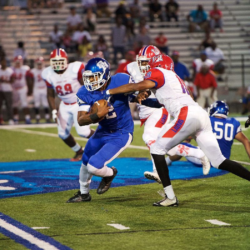 Sylvan Hills quarterback Jordan Washington scrambles up the middle during a game against Little Rock McClellan in September. Washington has completed 60 of 113 passes for 969 yards with 10 touchdowns and 2 interceptions this season, while rushing for 579 yards and 10 touchdowns on 102 carries. 