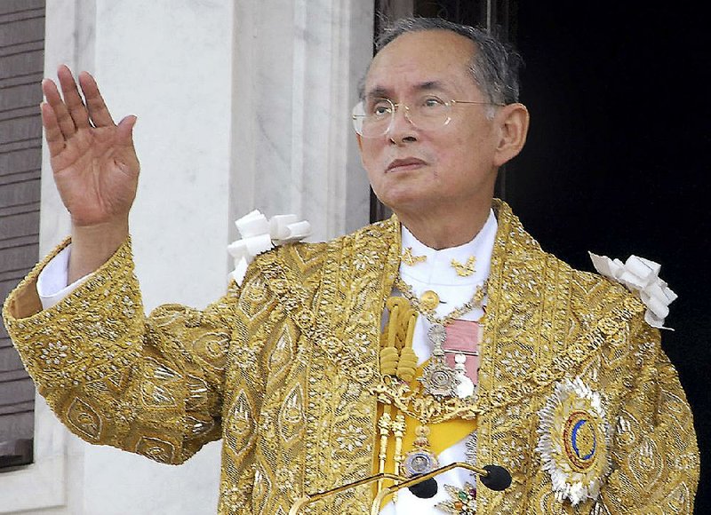 In this June 9, 2006, file photo released by the Thai Government Public Relations Department, Thailand King Bhumibol Adulyadej acknowledges the crowd in Bangkok during the celebrations of the 60th anniversary of his accession to the throne. 