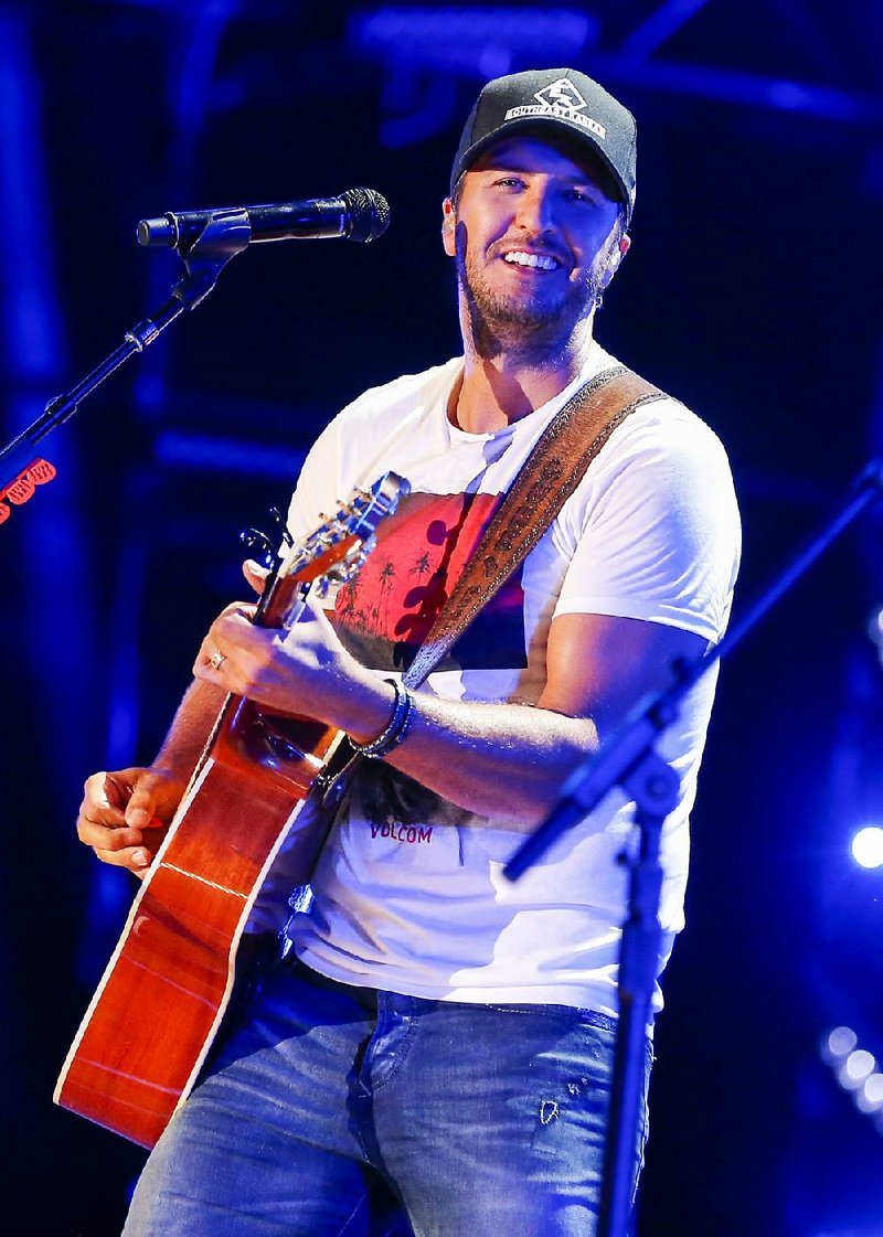 In this June 12, 2016 file photo, Luke Bryan performs at the CMA Music Festival in Nashville, Tenn. 