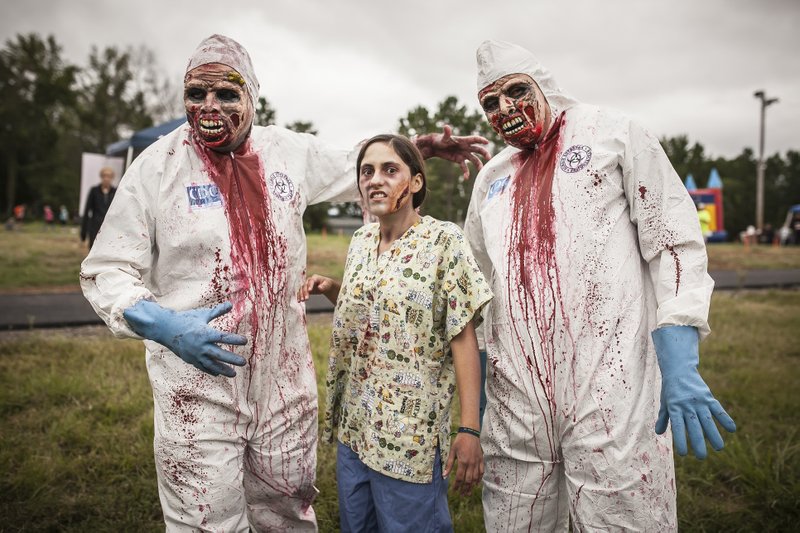 Zombie volunteers are stationed throughout the obstacle course with a goal of capturing runners’ life flags to “infect” them.