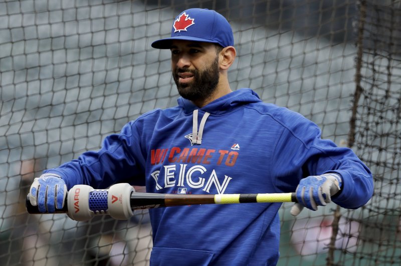 Toronto Blue Jays right fielder Jose Bautista holds a bat during practice in Cleveland, Thursday, Oct. 13, 2016 in preparation for Game 1 of baseball's American League Championship Series. 