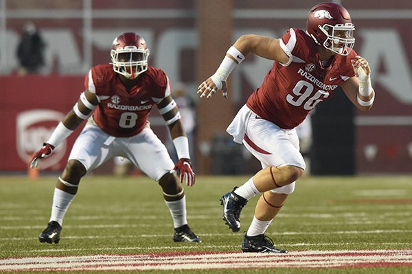 Arkansas defensive end Karl Roesler (96) and linebacker De'Jon Harris (8) run a play during a game against Alabama on Saturday, Oct. 8, 2016, at Donald W. Reynolds Razorback Stadium in Fayetteville.