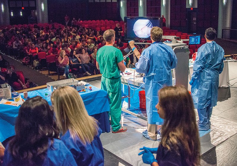 Orthopedic surgeon Joel Smith performs rotator-cuff surgery on a cadaver in the Cabot High School Auditorium.
Medical Academy students at Cabot High School witnessed the surgery to learn more about the field of medicine and decide which aspects interest them.