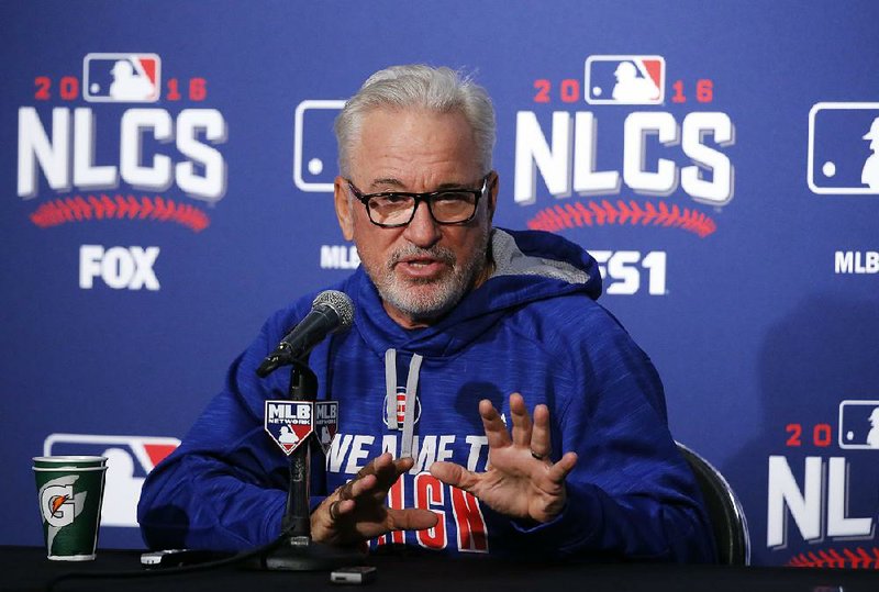 Chicago Cubs Manager Joe Maddon talks to reporters Friday during a news conference before Game 1 of the National League Championship Series against the Los Angeles Dodgers. Maddon, who came to Chicago in 2015 after leaving the Tampa Bay Rays, did so after longtime friend and former Rays General Manager Andrew Friedman left to become president of baseball operations for the Dodgers. 