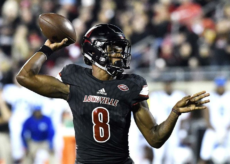 Louisville quarterback Lamar Jackson threw for a touchdown and ran for one late in the fourth quarter Friday to give the No. 7 Cardinals a 24-14 victory over Duke in Louisville, Ky.