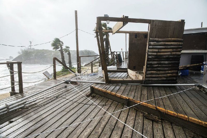 A tiki bar in Tobacco Bay, St. Georges, Bermuda, lays in shambles Thursday after Hurricane Nicole struck the island. 