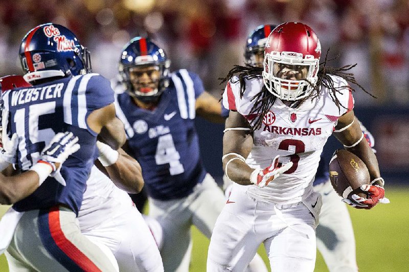 HAWGS ILLUSTRATED JASON IVESTER --11/07/2015--
Arkansas @ Ole Miss football
Arkansas running back Alex Collins carries the ball after recovering a lateral pass from Hunter Henry on Saturday, Nov. 7, 2015, during overtime against Ole Miss at Vaught-Hemingway Stadium in Oxford, Miss.