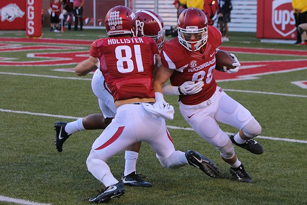 Arkansas receiver Drew Morgan runs with the ball while receiver Cody Hollister blocks during a game against Alabama on Saturday, Oct. 8, 2016, in Fayetteville. 