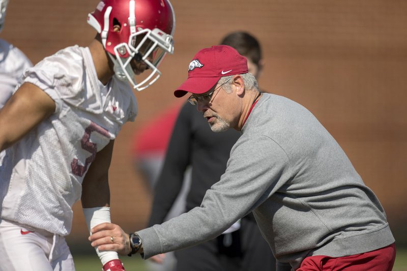 HAWGS ILLUSTRATED JASON IVESTER Paul Rhoads, defensive backs coach, works with junior defensive back Henre&#8217; Toliver during practice on March, 29, 2016, in Fayetteville.