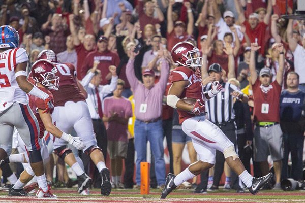 Arkansas receiver Jared Cornelius scores a touchdown during a game against Ole Miss on Saturday, Oct. 15, 2016, in Fayetteville. 