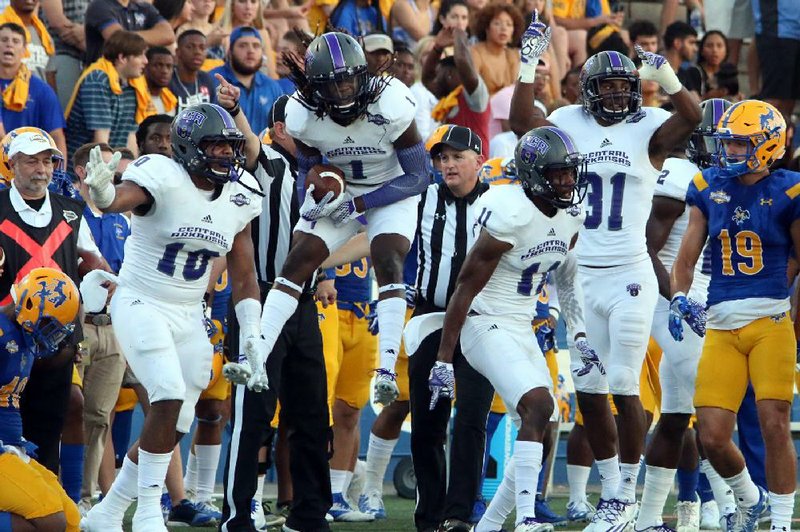 Central Arkansas’ Tremon Smith (1) celebrates a fumble recovery in the Bears’ 35-0 victory over McNeese State on Saturday night in Lake Charles, La.