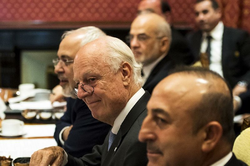 Iranian Foreign Minister Mohammad Javad Zarif (from left); Staffan de Mistura, the U.N. special envoy for Syria; and Turkish Foreign Affairs Minister Mevlut Cavusoglu attend the Syria meeting Saturday in Lausanne, Switzerland. The talks, lad by Secretary of State John Kerry and Russian Foreign Minister Sergey Lavrov, produced no concrete plans. 