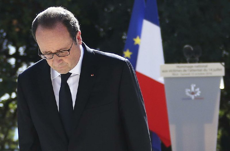 French President Francois Hollande bows Saturday to the families of people killed in the July 14 attack in Nice. 