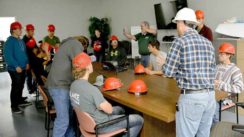 Janelle Jessen/Herald-Leader Mike Gatlin, manager of the Del Monte Country Plant, spoke to Career Academy of Siloam Springs students about safety before they went on a tour of the vegetable canning facility on Friday morning. Students also toured the Simmons Foods plant and the Swepco AEP Flint Creek Power Plant in Gentry.