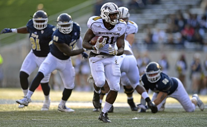Western Michigan running back Jarvion Franklin carries the ball in the second quarter of an NCAA college football game against Akron, Saturday, Oct. 15, 2016, in Akron, Ohio. (AP Photo/David Dermer)
