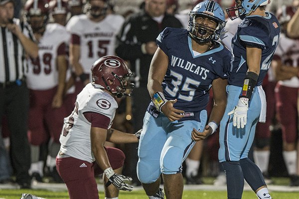 Har-Ber's Oliver Nasilai celebrates a tackle during a game against Springdale on Saturday, Sept. 30, 2016. 