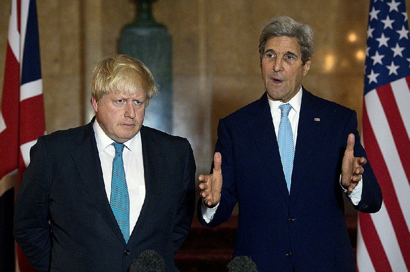 Boris Johnson (left), Britain’s foreign secretary, and U.S. Secretary of State John Kerry speak to the media during a joint news conference Sunday in London.