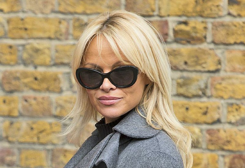 In this Wednesday, Oct. 12, 2016 file photo, Pamela Anderson poses for photographers, during a photo call, in London.