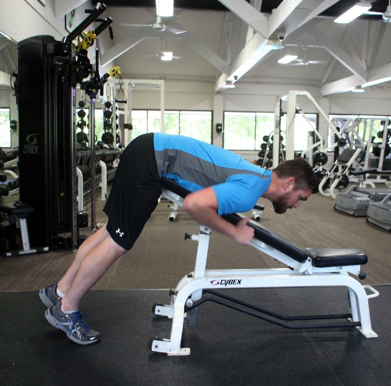 Chet Wessman of Conway does step 1 and 3 of the Reverse Hyperextension exercise 
