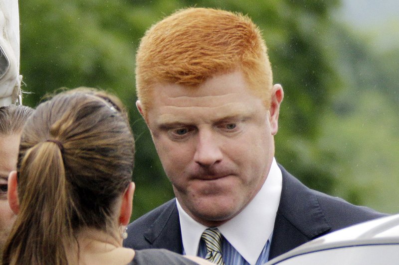 In this June 12, 2012, file photo, former Penn State University assistant football coach Mike McQueary arrives at the Centre County Courthouse in Bellefonte, Pa. 