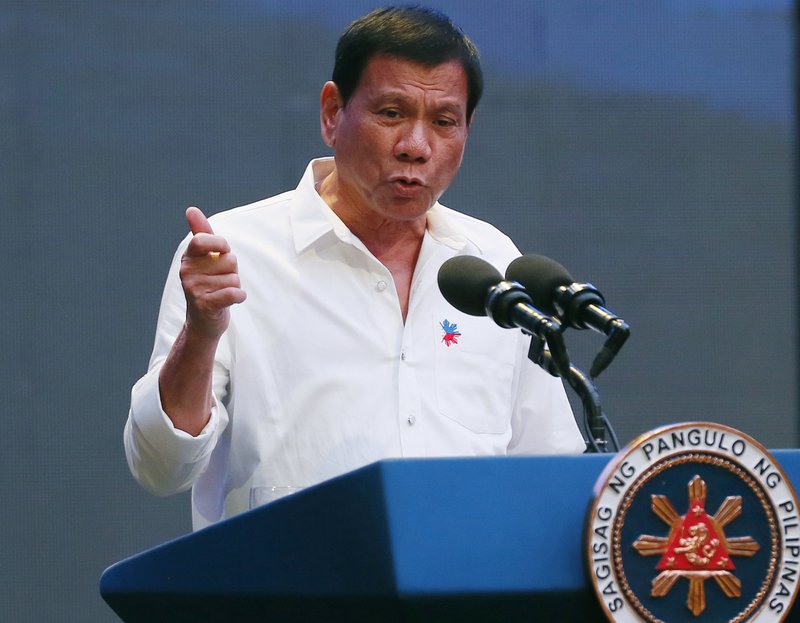 In this Thursday, Oct. 13, 2016, file photo, Philippine President Rodrigo Duterte gestures during his address to a Filipino business sector in suburban Pasay city, south of Manila, Philippines.