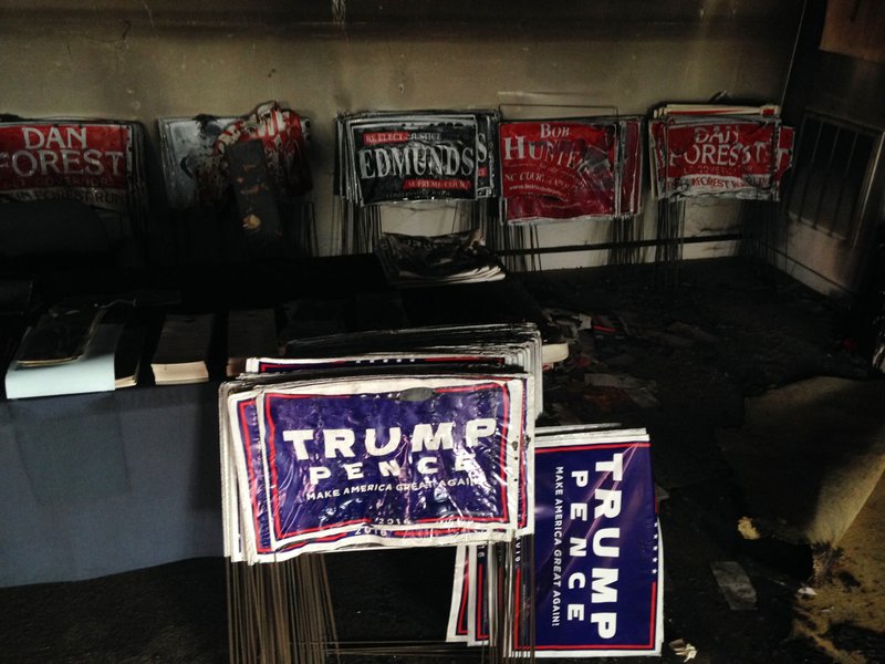 Melted campaign signs are seen at the Orange County Republican Headquarters in Hillsborough, NC on Sunday, Oct. 16, 2016. 