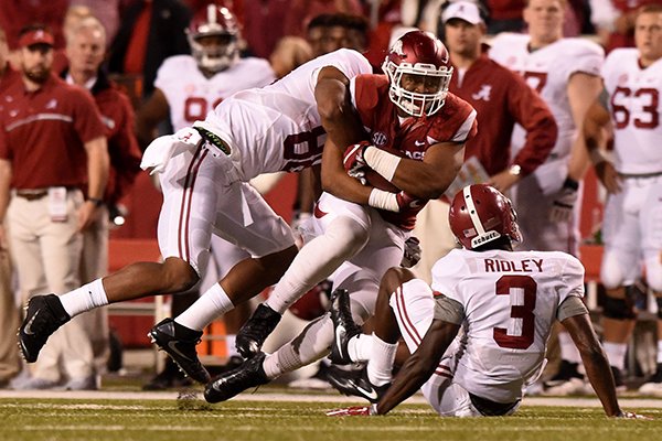 Arkansas linebacker Dwayne Eugene is tackled after making an interception during a game against Alabama on Saturday, Oct. 8, 2016, in Fayetteville. 