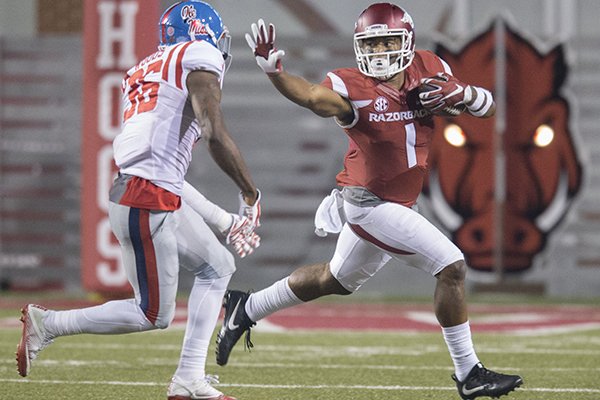 Arkansas receiver Jared Cornelius runs after a catch during a game against Ole Miss on Saturday, Oct. 15, 2016, in Fayetteville. 