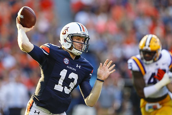 FILE - In this Sept. 24, 2016, file photo, Auburn quarterback Sean White (13) throws a pass against LSU during the first half of an NCAA college football game, in Auburn, Ala. The 21st-ranked Auburn Tigers have definitely shown signs of improvement in recent weeks, but Saturday's game with No. 17 Arkansas will give a better gauge of where they stand. (AP Photo/Butch Dill, File)

