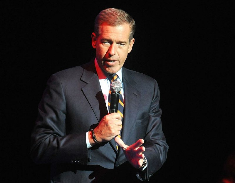 FILE - In this Nov. 5, 2014, file photo, Brian Williams speaks at the 8th Annual Stand Up For Heroes, presented by New York Comedy Festival and The Bob Woodruff Foundation in New York. NBC News gave Williams a second chance after he was caught lying about his role in stories, while Billy Bush apparently won’t get the same opportunity following his profane 2005 conversation with Donald Trump. The mistakes of Williams and Bush were different, but in both cases NBC executives needed to weigh whether it was worth rehabilitating them.  (Photo by Brad Barket/Invision/AP, File)
