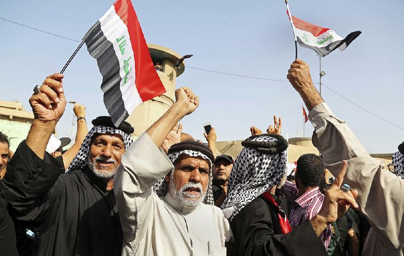 Supporters of Iraqi Shiite cleric Muqtada al-Sadr protest Tuesday in front of the Turkish Embassy in Baghdad, calling for the immediate withdrawal of Turkish troops from northern Iraq. 