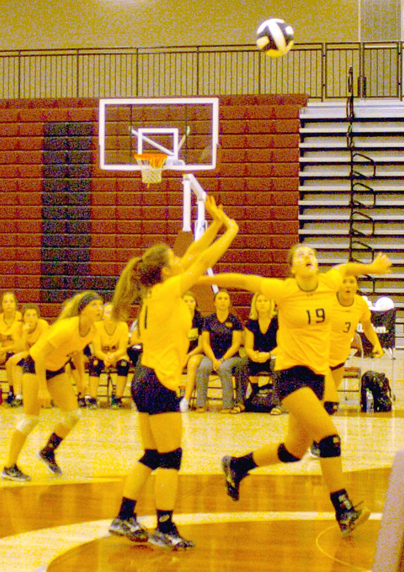 MARK HUMPHREY ENTERPRISE-LEADER Prairie Grove senior hitter Riley Gerwig gathers herself as she eyes a set by classmate Kara Anderson. Prairie Grove defeated Lincoln in straight sets, 25-11, 25-12, 25-21, on the Lady Wolves&#8217; home court Sept. 20. The Lady Tigers also won the rematch at home, 25-13, 25-18, 25-15, on Oct. 3.