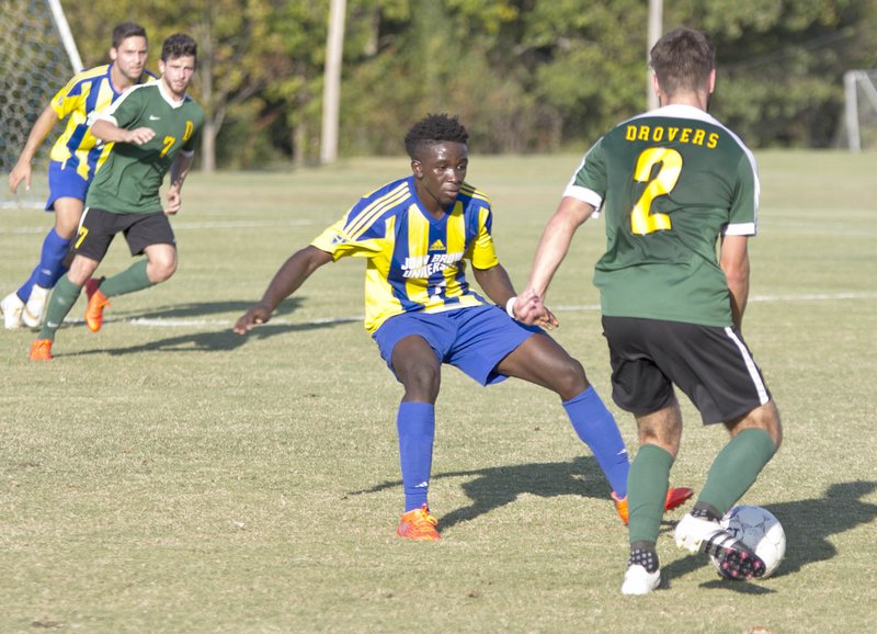 Photo courtesy of JBU Sports Information John Brown sophomore midfielder Kelvin Omondi defends Saturday against Science and Arts of Oklahoma.