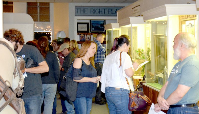 Michael Burchfiel/Herald-Leader When they weren&#8217;t visiting the bars of Siloam Springs, participants in Oktoberfest: Tap into History toured the Siloam Springs Museum, where several artifacts relating to Simon Sager were on display to highlight Siloam Springs&#8217; German roots.