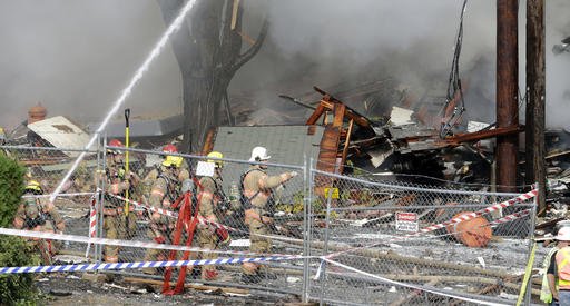 Firefighters battle a blaze after a gas explosion in Portland, Ore., Wednesday, Oct. 19, 2016. 