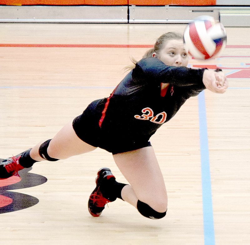 PHOTO BY RICK PECK McDonald County&#8217;s Destiny Arnall dives for a ball during the Lady Mustangs 25-18, 25-19 loss to Republic in the opening round of the Missouri Class 4 District 12 Volleyball Tournament on Monday night at Webb City High School.