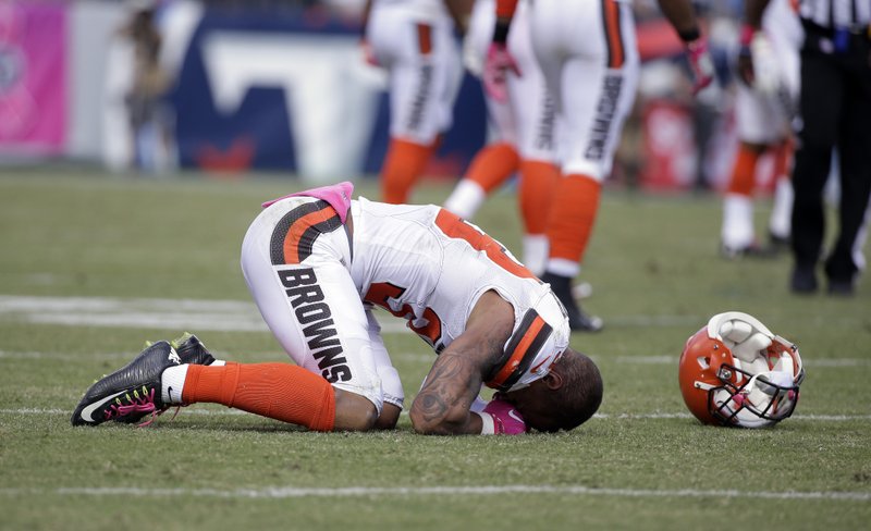 In this Sunday, Oct. 16, 2016, file photo, Cleveland Browns free safety Jordan Poyer falls to the ground after being injured in the first half of an NFL football game against the Tennessee Titans in Nashville, Tenn. 