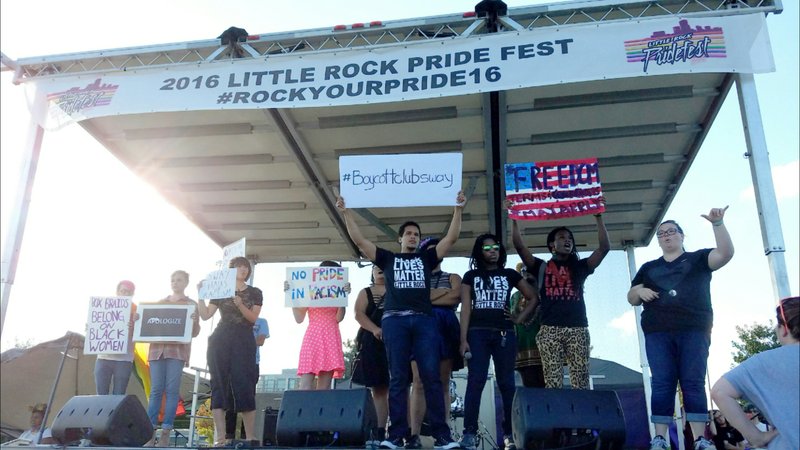 Black Lives Matter Little Rock activists take the stage at an LGBT Pride Festival over the weekend to protest a popular gay bar. 