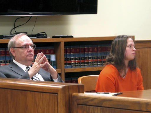 In this Aug. 20, 2015, file photo, Brittany Pilkington, right, and her attorney Marc Triplett, left, listen as a judge sets a $1 million bond in her case during a hearing in Bellefontaine, Ohio.