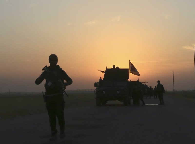 Iraq’s elite counterterrorism forces advance Thursday toward the city of Mosul, Iraq.
