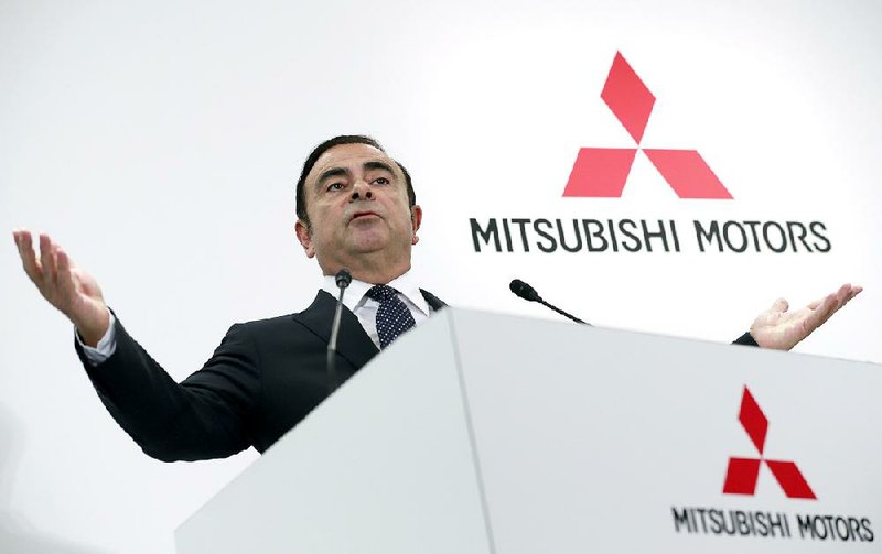 Nissan Motor Co. CEO Carlos Ghosn speaks during a joint news conference with Mitsubishi Motors Corp. CEO Osamu Masuko in Tokyo, on Thursday.