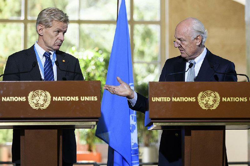 Staffan de Mistura (right) U.N. special envoy for Syria, and Jan Egeland, his senior adviser, attend a news conference Thursday at the European headquarters of the United Nations in Geneva.